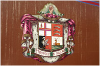 The Metropolitan Railway logo on the side of a carriage in storage VIS VINCTA SERVIT